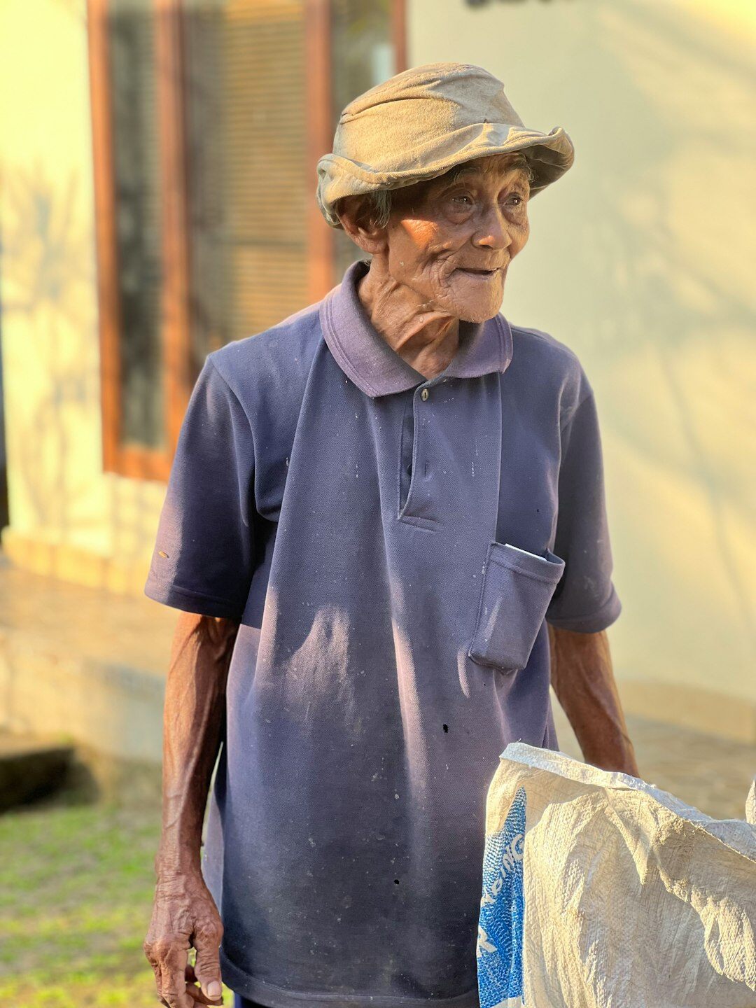 elderly man helping neighbor