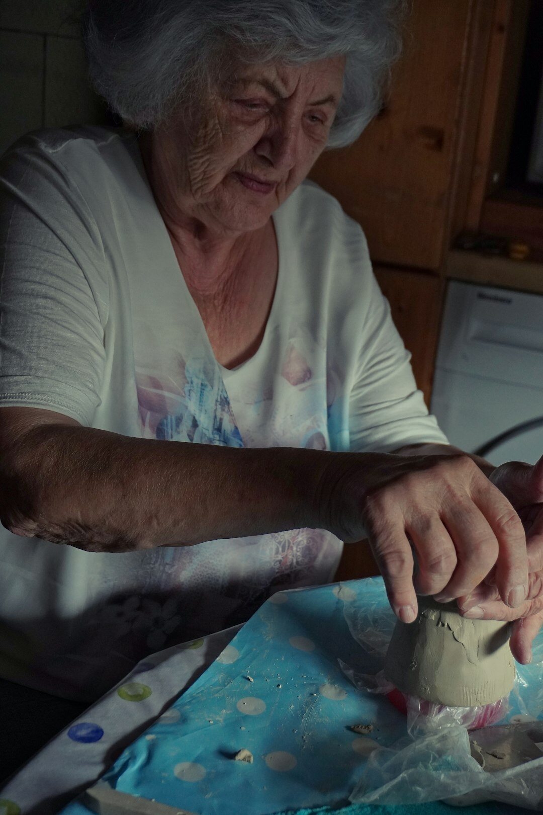elderly woman sharing story in kitchen